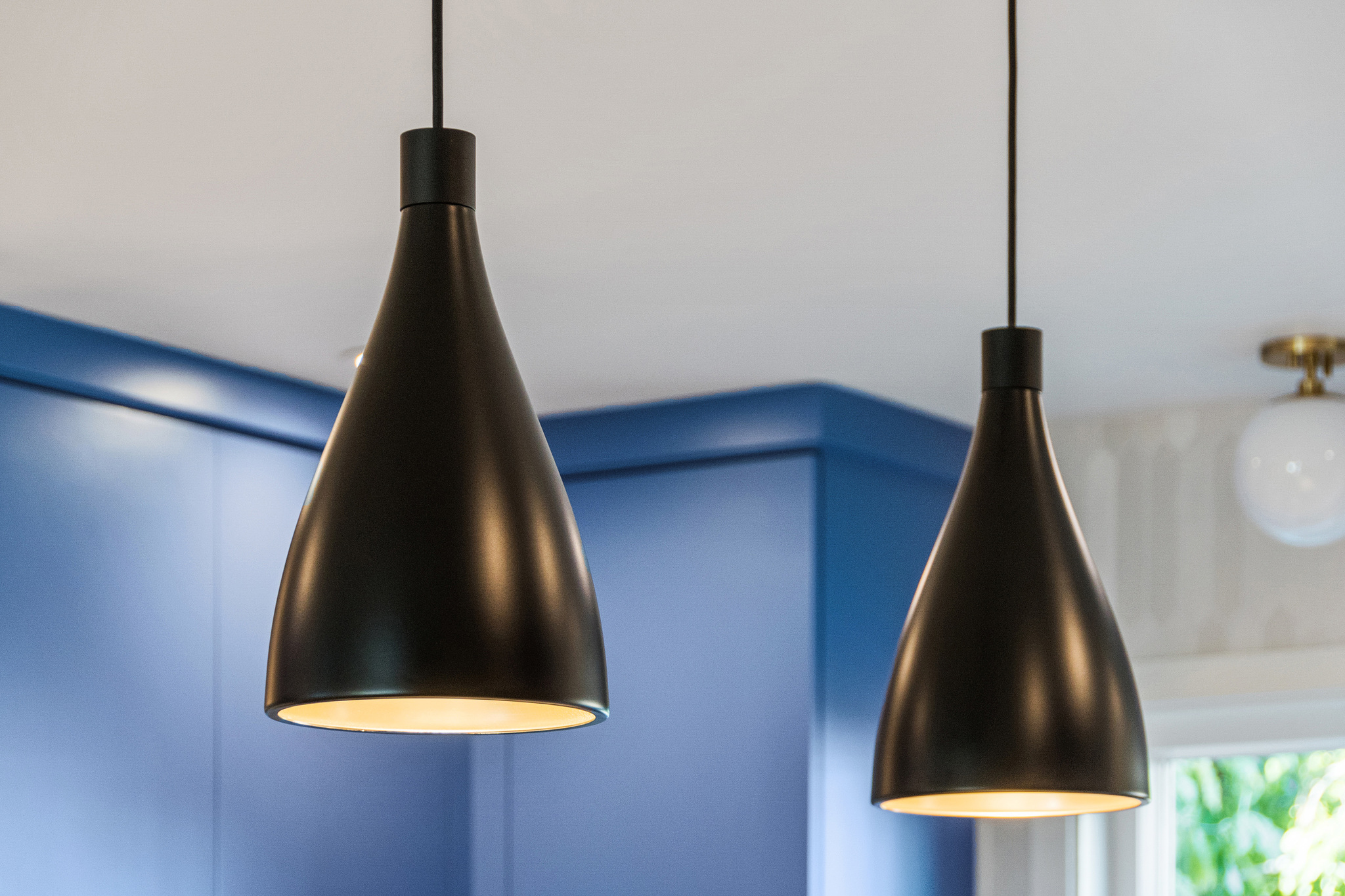 black pendant lights in a modern kitchen