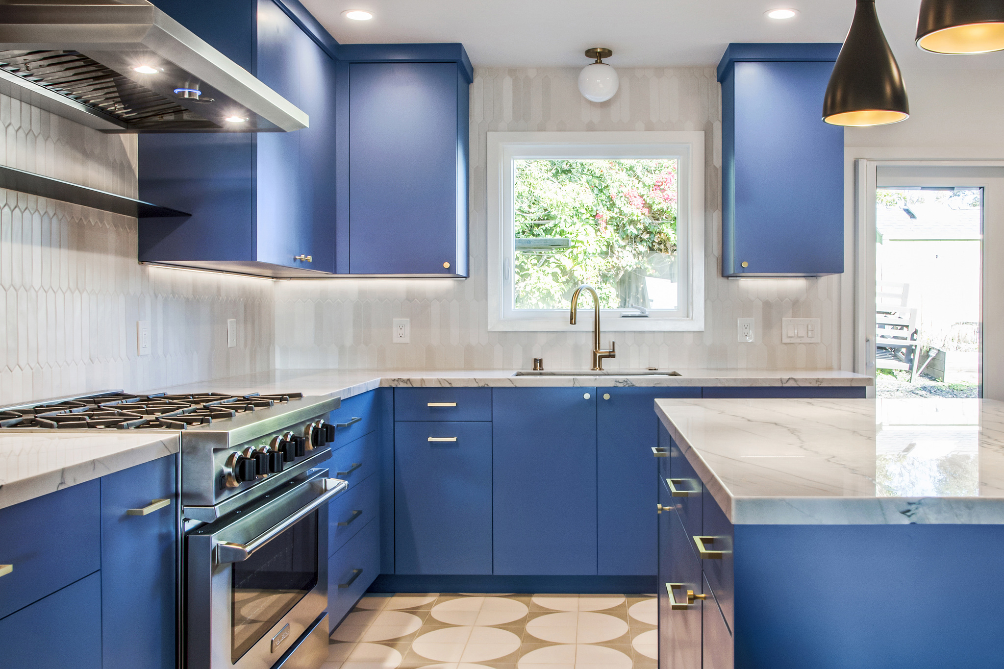 modern blue cabinets with warm accent lighting